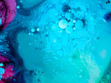 Beautiful oil colors of the universe. Bright colored bubbles sparkling. Abstract Acrylic Liquid Painting Texture. Macro Background Wallpaper. Oil Ink Acrylic Paint Spread Blast Explode Galaxy 