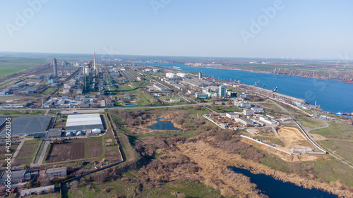 Sea bay. Port Yuzhny and the Port Plant view from the sea from a helicopter.