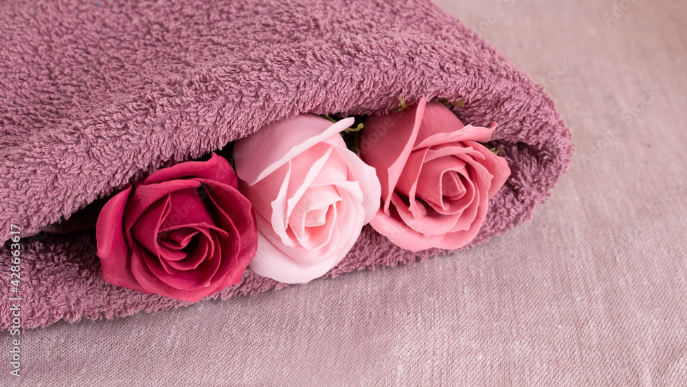 Floral fragrant soap roses and lilac terry towel for a shower. Aroma and purity of the body. Floral fragrant soap roses and lilac terry towel for a shower. Aroma and purity of the body.
