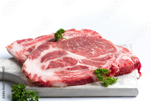 Raw pork meat slice on white background