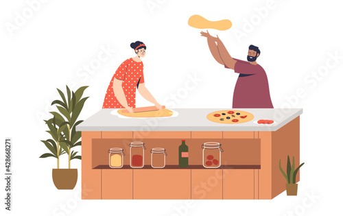 Couple cook pizza together at home. Young family man and woman preparing dinner