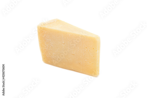 Piece of parmesan cheese isolated on white background. Block of Italian hard cheese close up view.