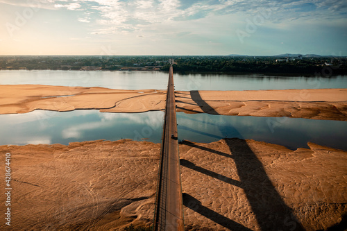 aerial image with drone at sunset of the Rio Branco river and the bridge in the City of Boa Vista Roraima Brazil photo