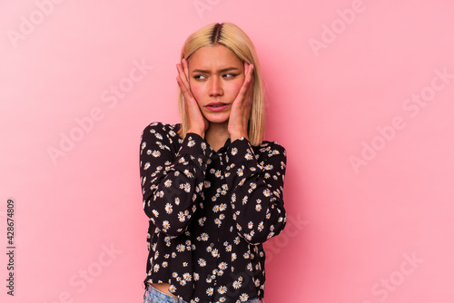 Young venezuelan woman isolated on pink background whining and crying disconsolately. © Asier