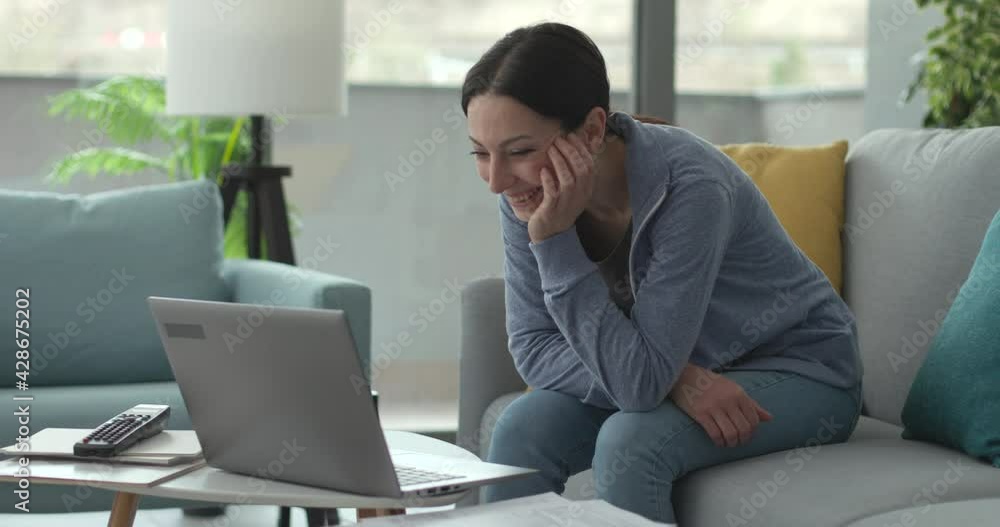 Cheerful woman video calling her friends Cheerful woman video calling her friends