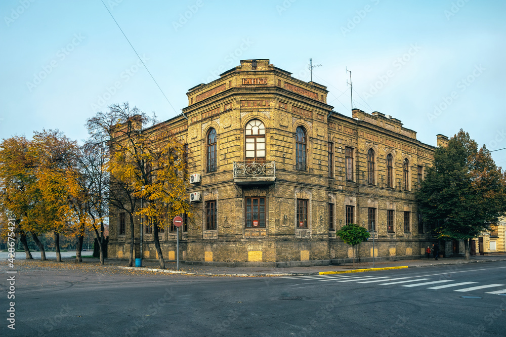 Kremenchuk, Ukraine - November 14, 2020: building of the old state bank, an ancient financial institution on the city square in the city of Kremenchuk, Ukraine. Vintage architecture in Eastern Europe