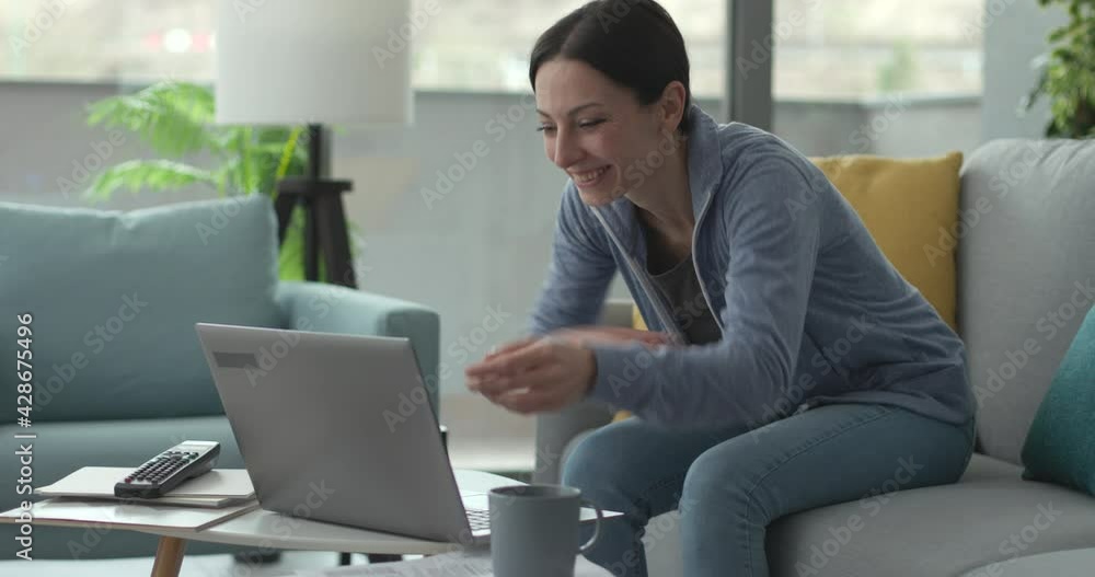 Cheerful woman video calling her friends Cheerful woman video calling her friends