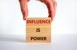 Influence is power symbol. Wooden blocks with words 'Influence is power'. Beautiful white background, businessman hand. Business, influence is power concept, copy space.