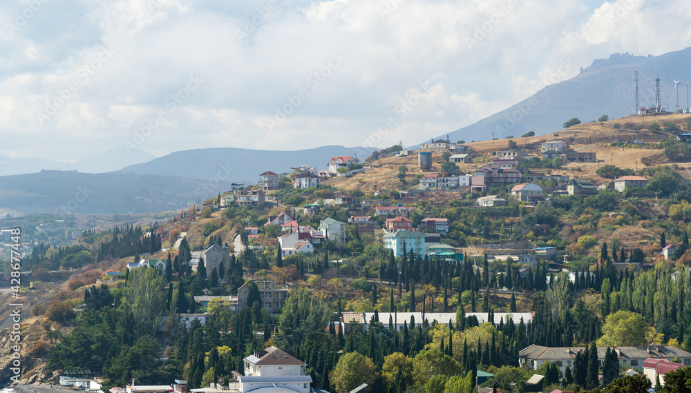 Naklejka premium Landscape opened from observation deck of Church-lighthouse of St. Nicholas Miracle-Worker of Myra at Malorechenskoye village on Black Sea coast. Malorechenskoye, Crimea, Russia - October 01, 2019.
