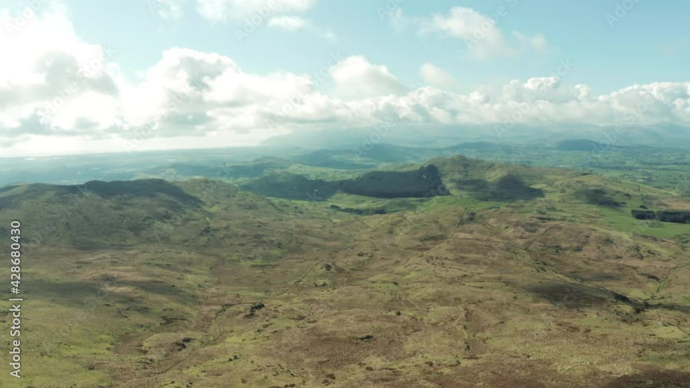 Aerial Flight Over Mourne mountain slieve croob area countryside, Newry, Northern Ireland during Spring morning time Hiking and Tourism Concept Aerial Flight Over Mourne mountain slieve croob area countryside, Newry, Northern Ireland during Spring morning time Hiking and Tourism Concept