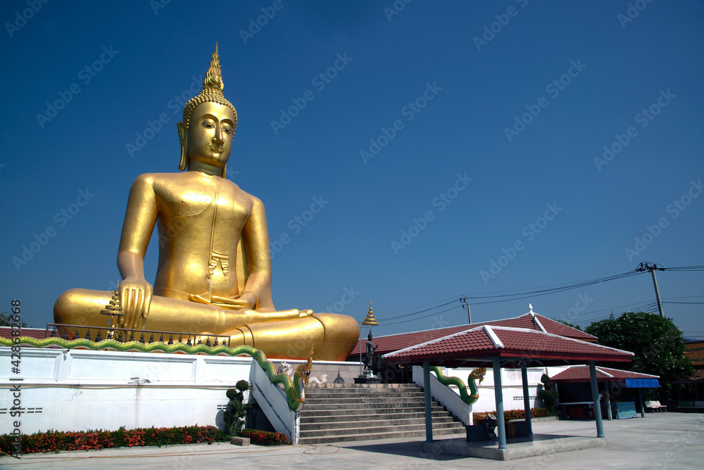 Large outdoor golden sitting Buddha Enshrined at Wat Bang Chak. Which can be clearly seen from afar Because it is located on the Chao Phraya River and is a famous place. Large outdoor golden sitting Buddha Enshrined at Wat Bang Chak. Which can be clearly seen from afar Because it is located on the Chao Phraya River and is a famous place.