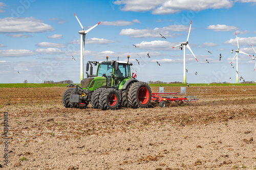 Tractor while cultivating on the field | 5044