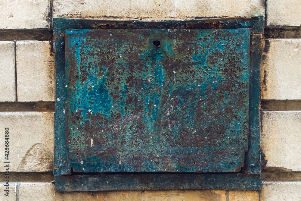 Rust and peeling paint on a metal door Rust and peeling paint on a metal door