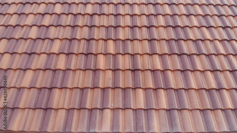 Modern brown roof of new house in suburban architech construction site aerial view Modern brown roof of new house in suburban architech construction site aerial view