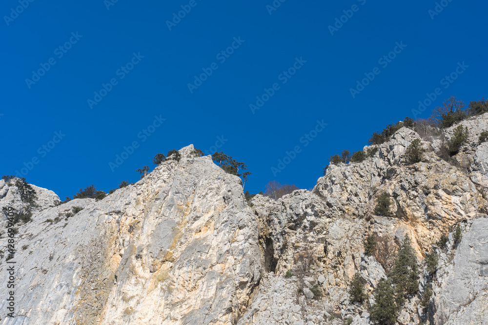 Inaccessible white rocks in the Crimea in early spring. Great place for mountaineering.