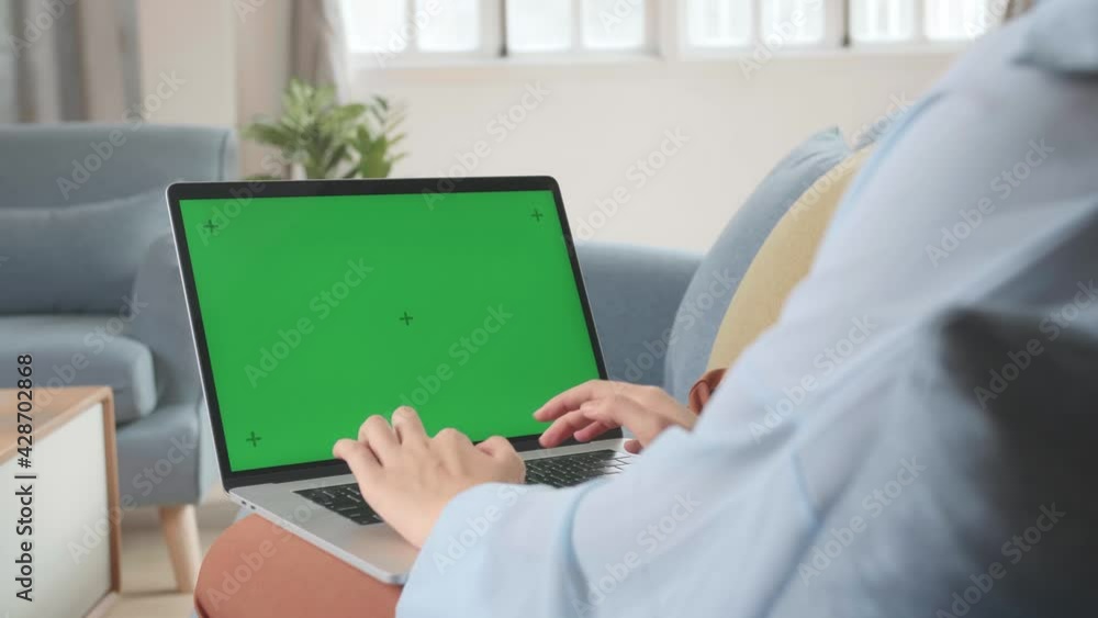 Female Working On Laptop With Green Screen Display Female Working On Laptop With Green Screen Display
