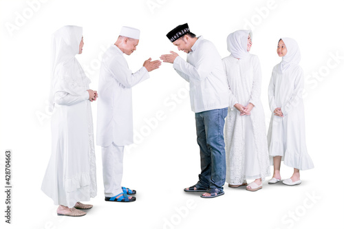 Man visiting parents with his family at Eid Mubarak