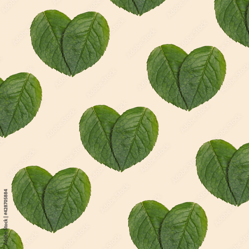Pattern with Natural green leaves in heart shape design background. Ecology friendly minimal concept