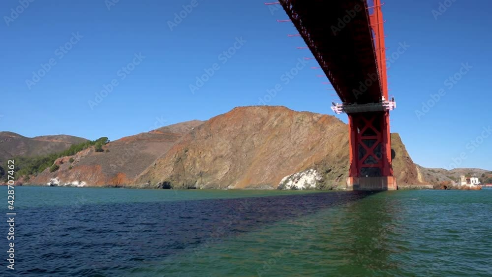 Sailing Under Golden Gate Bridge, San Francisco, California USA. Iconic Landmark on Sunny Day Sailing Under Golden Gate Bridge, San Francisco, California USA. Iconic Landmark on Sunny Day