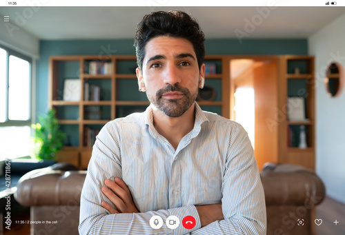 Фотография Business man on a work video call from home.