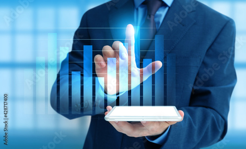 Businessman with tablet com...