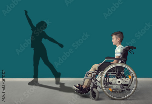 Boy in wheelchair dreaming ...