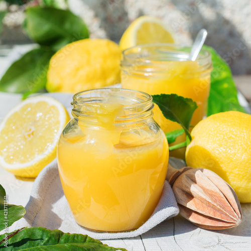 Homemade lemon curd, custard cream with yellow fruits