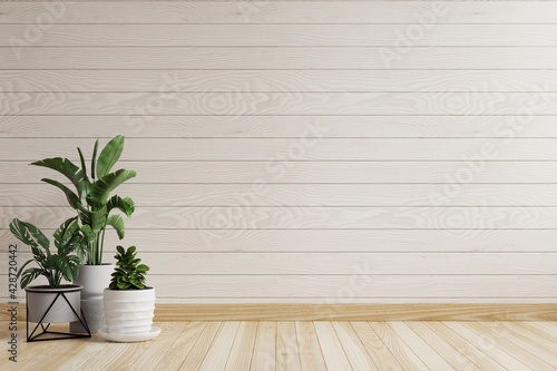 Empty room with beautiful patterned white wooden walls. There are trees on the side of the ground.3d rendering.