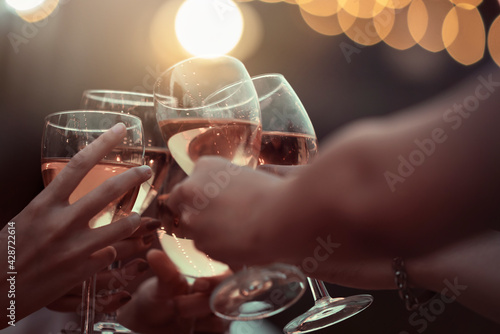 Party time start. Happy people toasting with champagne flutes. Multiethnic friends congratulating each other with new year. Celebration holiday concept, holiday background. selective focus