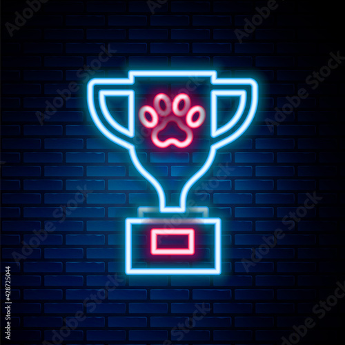 Glowing neon line Pet award symbol icon isolated on brick wall background. Medal with dog footprint as pets exhibition winner concept. Colorful outline concept. Vector