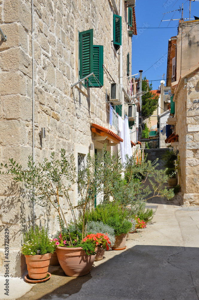 A narrow street in the historic center of Split, an ancient city in Croatia.