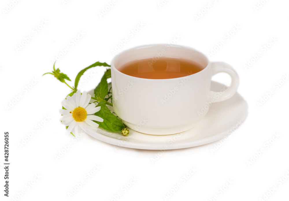 herbal chamomile tea in white porcelain cup on white background herbal chamomile tea in white porcelain cup on white background
