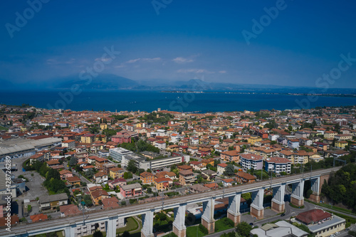 Panoramic aerial view of the city of Desenzano del garda, Italy. Lake Garda, mountains
