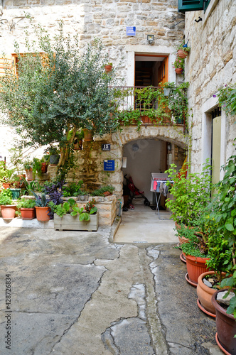 Fototapeta Naklejka Na Ścianę i Meble -  A narrow street in the historic center of Split, an ancient city in Croatia.
