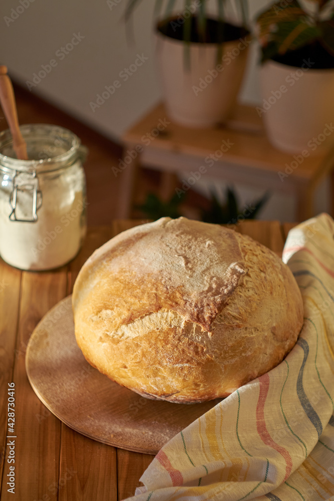 Homemade sourdough bread, side view.