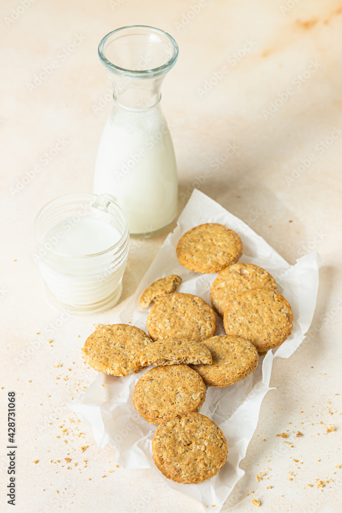 Healthy oatmeal or multigrain cookies with seeds and nuts on baking paper, light concrete background. Healthy oatmeal or multigrain cookies with seeds and nuts on baking paper, light concrete background.