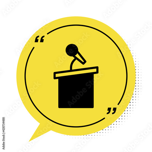 Black Stage stand or debate podium rostrum icon isolated on white background. Conference speech tribune. Yellow speech bubble symbol. Vector