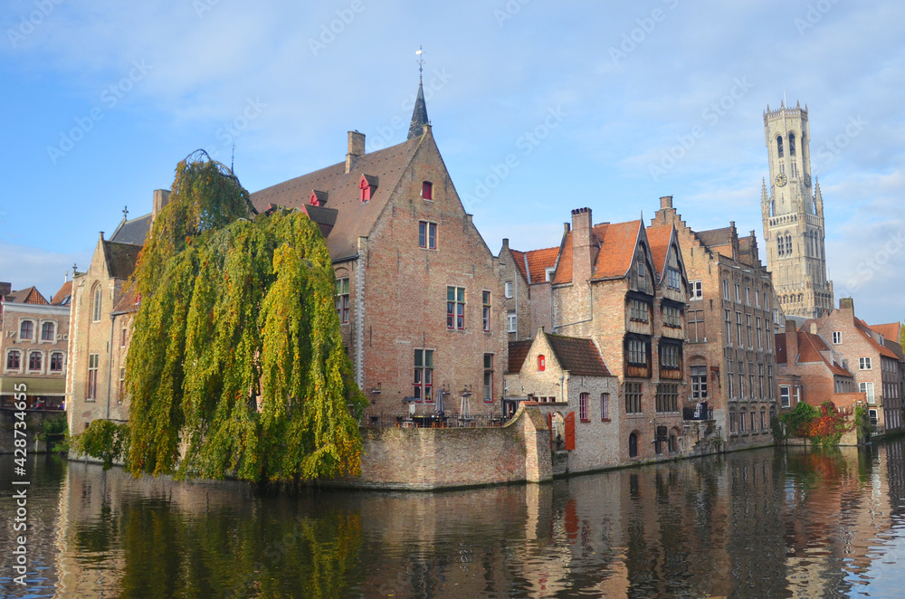 Fototapeta premium Autumn in Bruges, Belgium. Bruges, the capital of West Flanders in northwest Belgium, is distinguished by its canals, cobbled streets and medieval buildings.