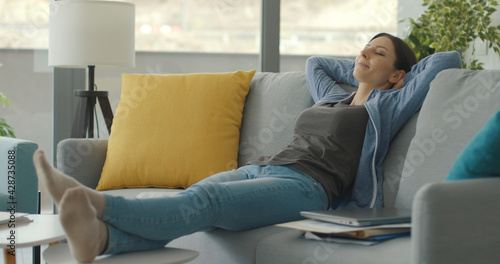 Woman taking a break and resting on the couch