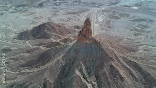 The camera flies out of The Faisal's Finger rock near Riyadh, Saudi Arabia. A view from the Tuwaiq escarpment. photo