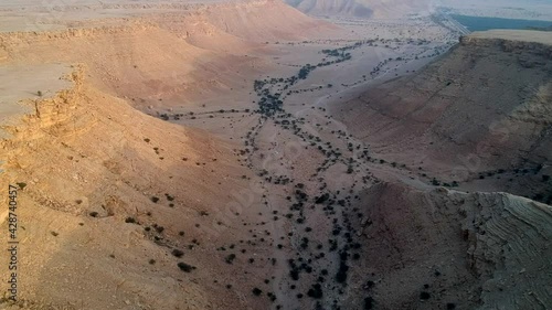 Camera flying over a canyon, Dirab, Saudi Arabia photo