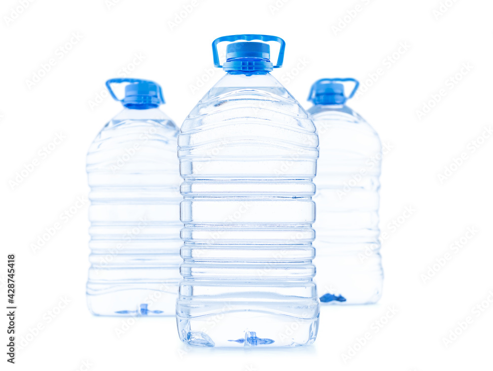 Three large plastic bottles of clean water for drinking, isolated on white background. Three large plastic bottles of clean water for drinking, isolated on white background.