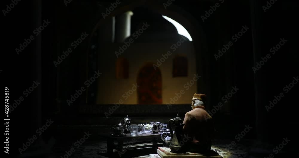A realistic Arabian interior miniature with window and columns. Meals are served before sunrise called Suhur. Festive greeting card, invitation for Muslim holy month Ramadan Kareem. Selective focus A realistic Arabian interior miniature with window and columns. Meals are served before sunrise called Suhur. Festive greeting card, invitation for Muslim holy month Ramadan Kareem. Selective focus