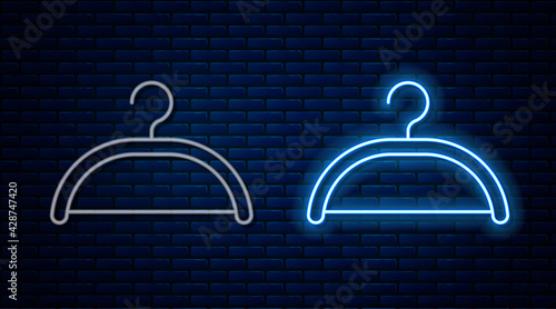 Glowing neon line Hanger wardrobe icon isolated on brick wall background. Cloakroom icon. Clothes service symbol. Laundry hanger sign. Vector