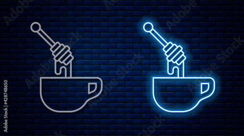 Glowing neon line Honey dipper stick with dripping honey icon isolated on brick wall background. Honey ladle. Vector