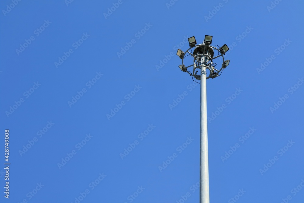 Street lights tower with clear blue sky background. Technology and nature concept. Street lights tower with clear blue sky background. Technology and nature concept.