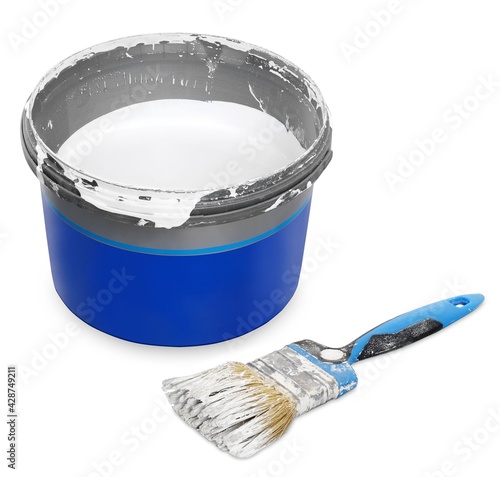 Isolated on with background open can of white paint and dirty paintbrush