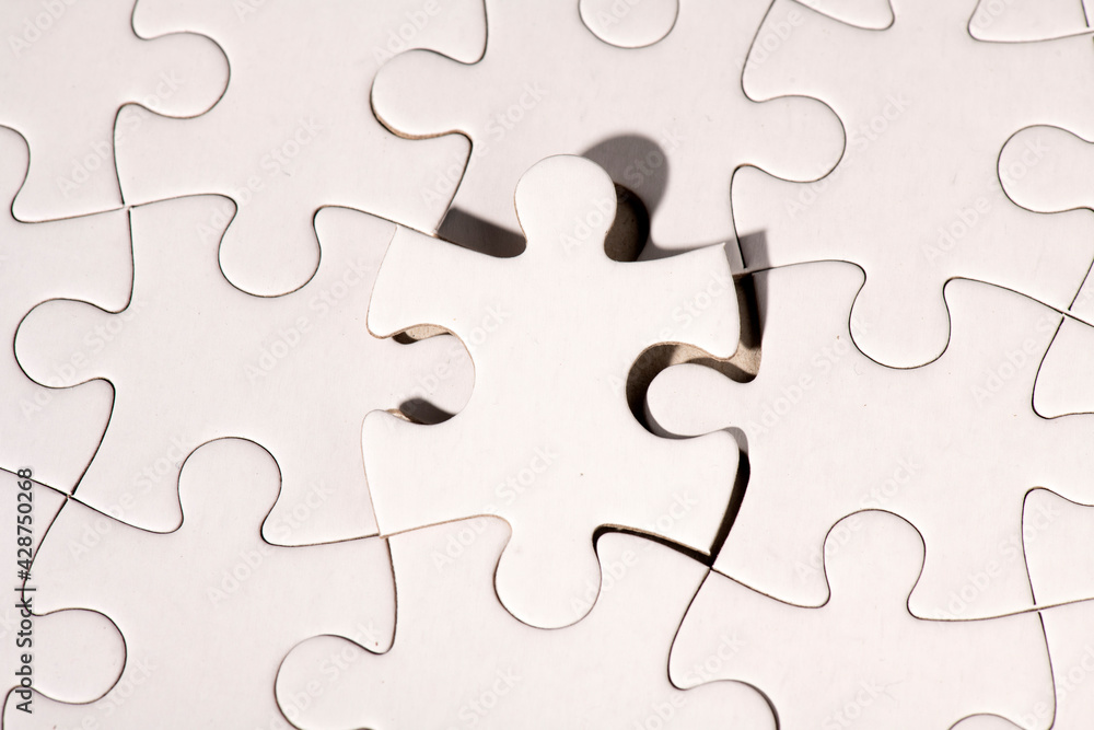 Top view of white jigsaw puzzle