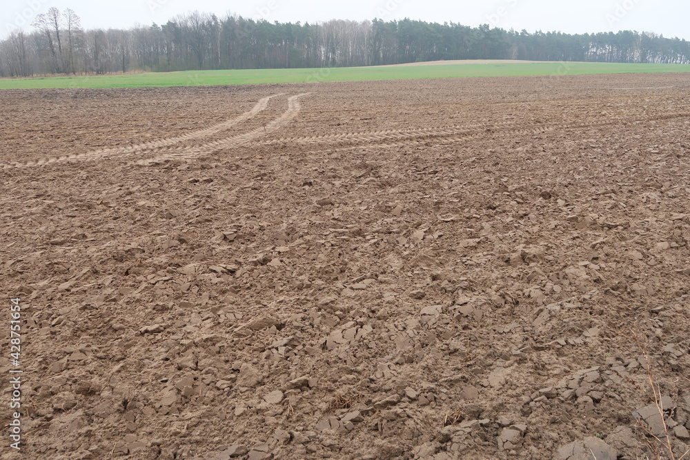 Tractor tire tracks on a plowed field Tractor tire tracks on a plowed field