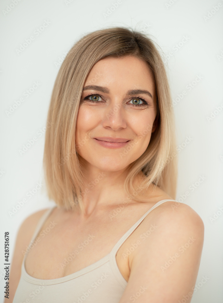 Beautiful calm middle aged woman, natural light. Anti-aging and beauty treatment. Beautiful calm middle aged woman, natural light. Anti-aging and beauty treatment.